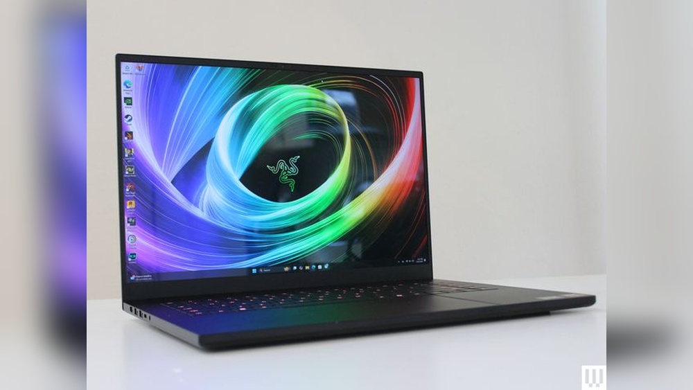 Razer Blade gaming laptop with colorful screen displaying Razer logo