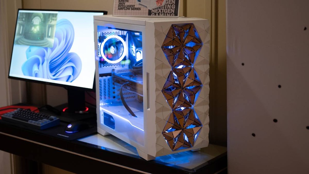 White custom gaming PC with unique geometric front panel design and blue LED lighting